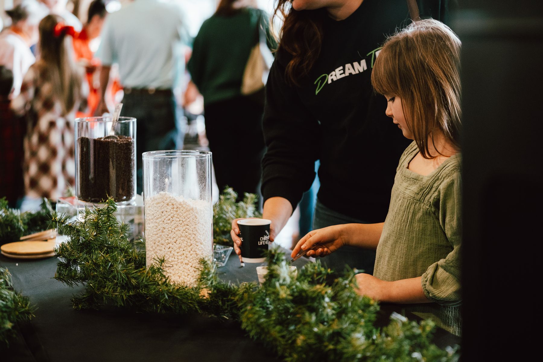 A child at a Christmas craft table